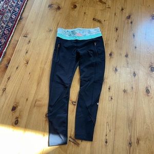 Lululemon leggings with colorful waistband and mesh cutouts